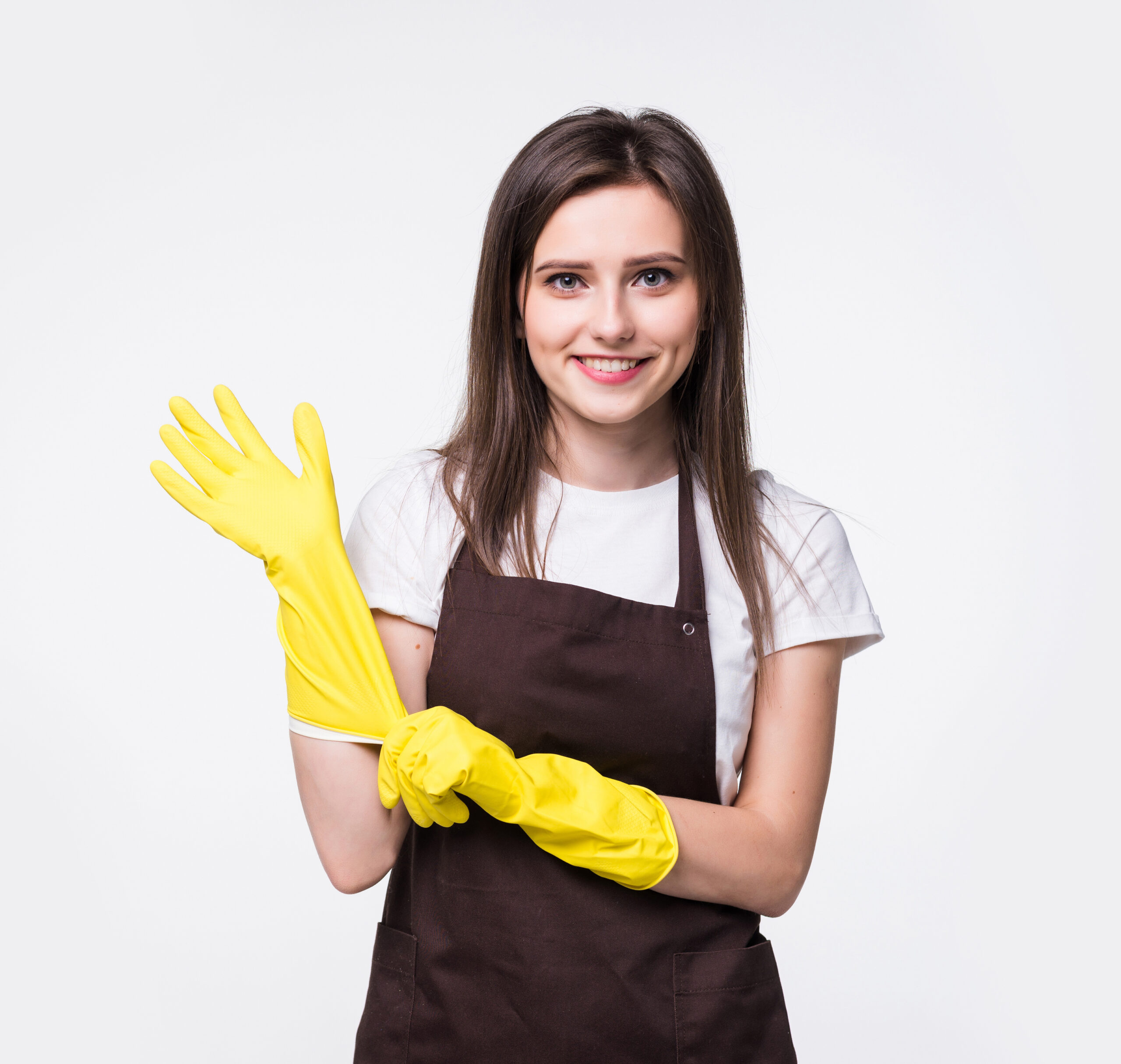 Portrait of young attractive housewife isolated on white background. Housekeeper woman wearing rubber gloves.